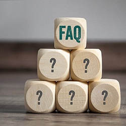 Pyramid of wooden blocks with question marks