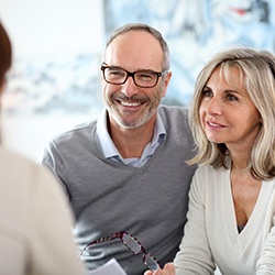 Couple at a dental implant consultation