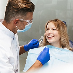 Patient talking to her dentist about dental implants
