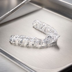 Clear nightguard for bruxism on metal tray