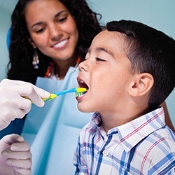 Child receiving fluoride treatment