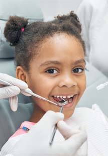 Child smiling during dental checkup