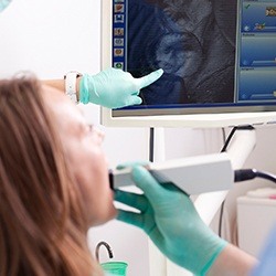 Dentist and patient looking at intraoral images