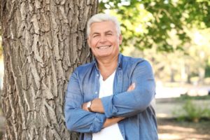 mature man smiling outdoors