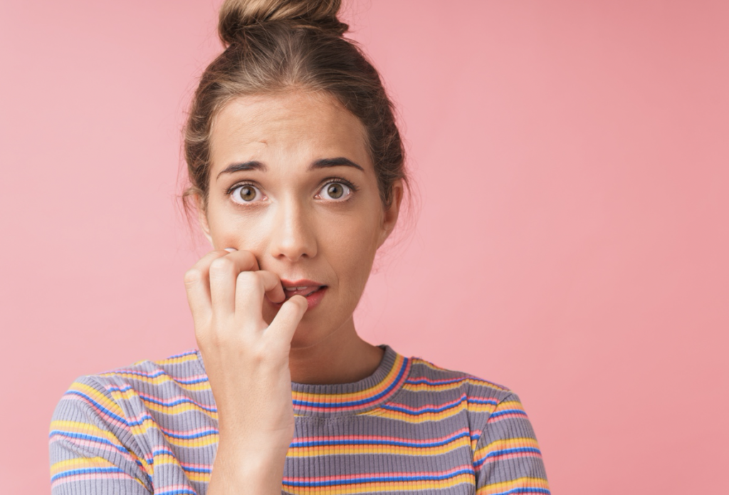 woman biting nails with dental implants